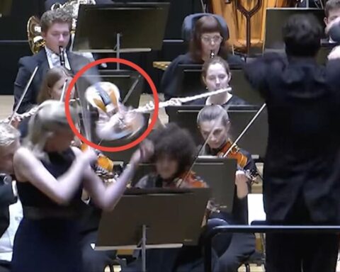 dirigent-schlägt-geige-hand