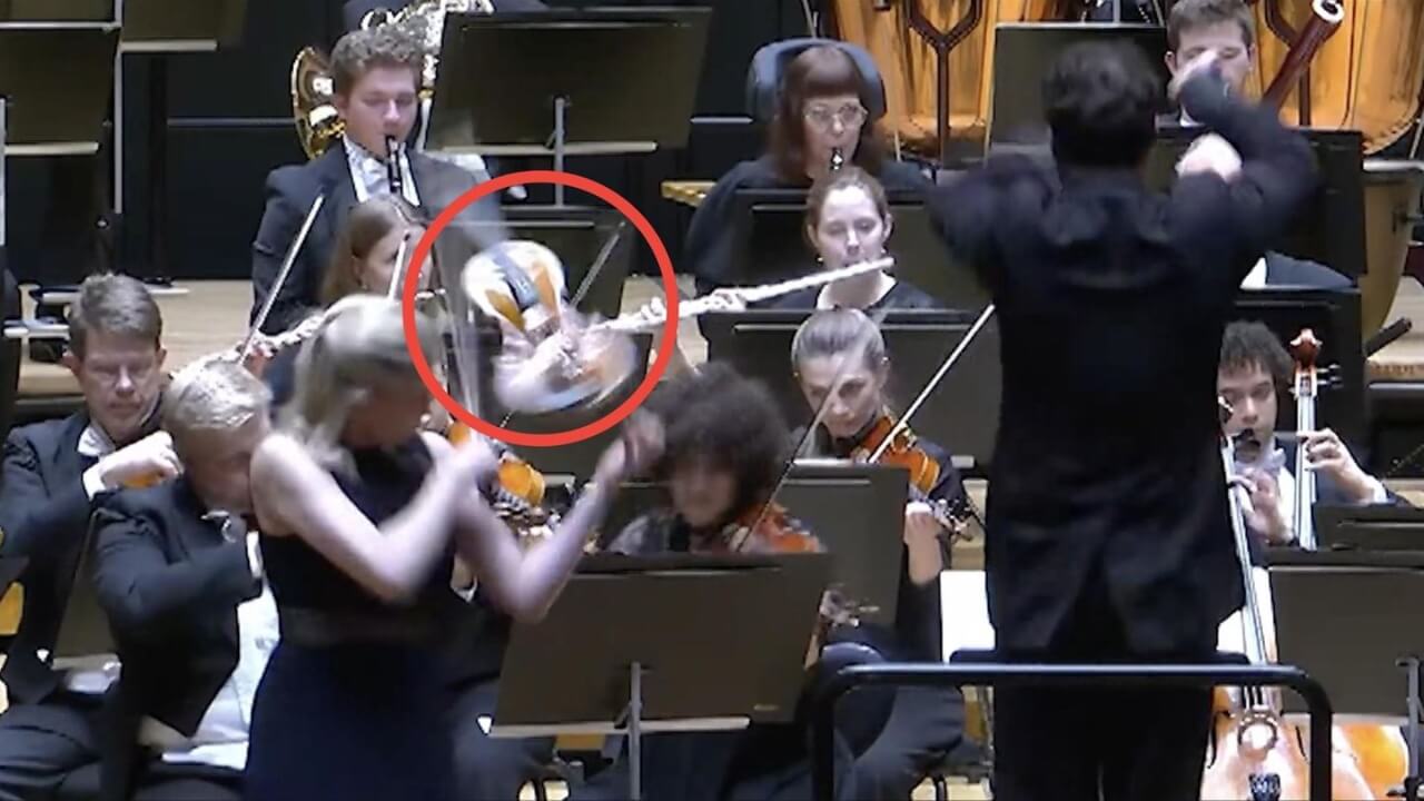 dirigent-schlägt-geige-hand